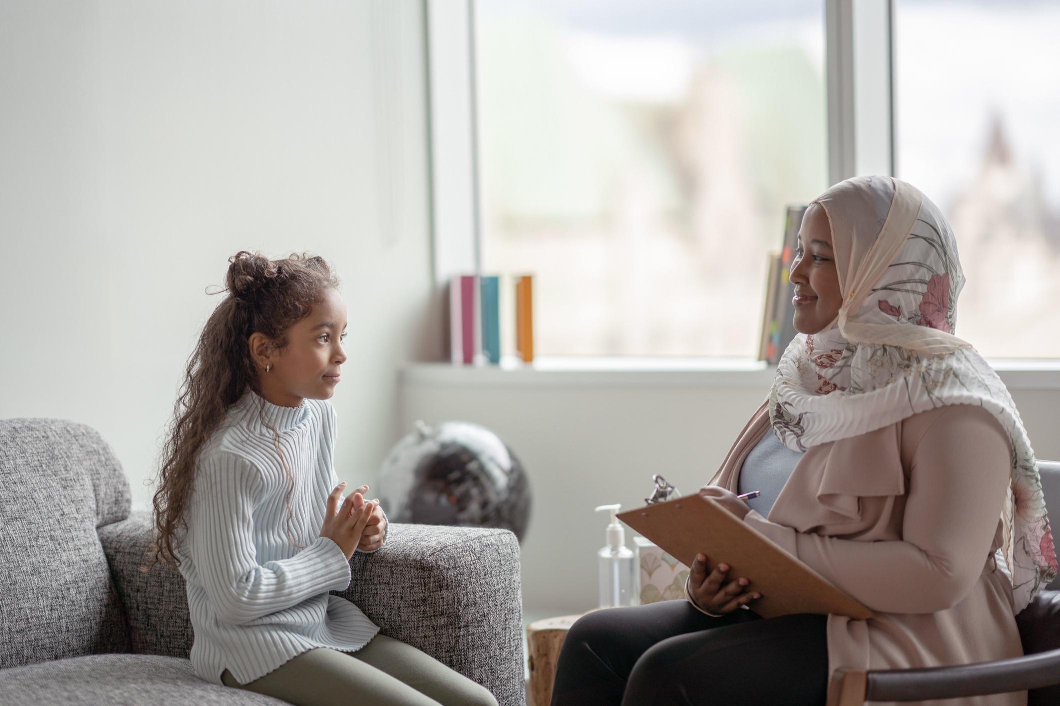 therapist helping child